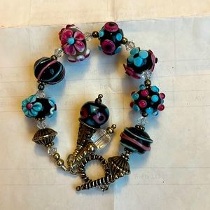 Hand Painted Glass Beaded Bracelet, with black, pink and turquoise colors.